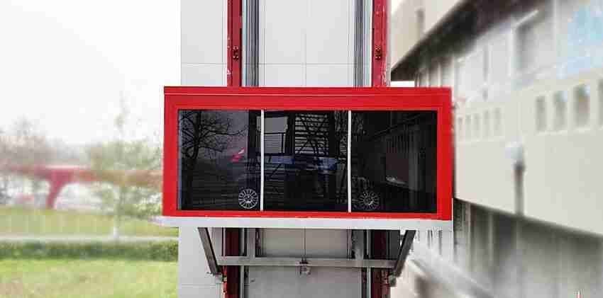 PARKPIÙ car lift with red and white structure