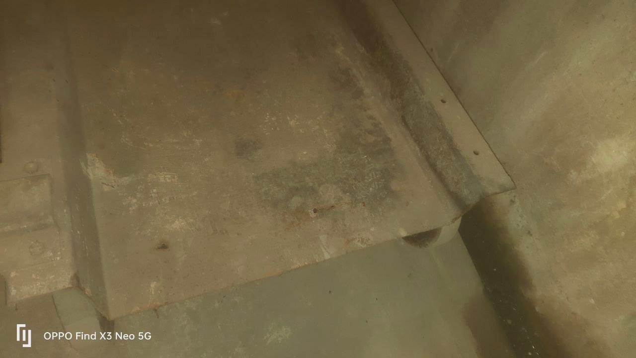 Rusty automated parking platforms with yellow edges, dirty and oxidized platforms